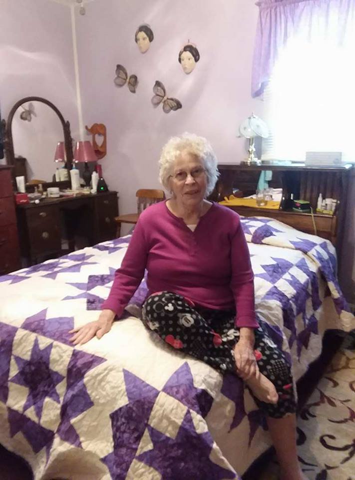 Alice B. with her "Festive Stars" quilt