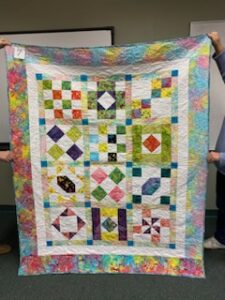 "Happiness is Quilting" a 2017 BOM quilt made by Carolyn K. from the El Campo Casual Quilt Guild. It's an original quilt design by TK Harrison from BOMquilts.com!