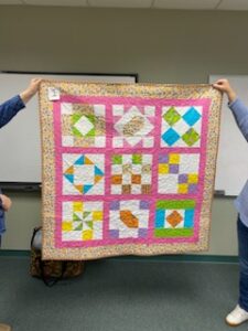 "Happiness is Quilting" a 2017 BOM quilt made by Dana W. from the El Campo Casual Quilt Guild. It's an original quilt design by TK Harrison from BOMquilts.com!