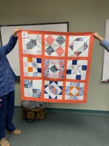 "Happiness is Quilting" a 2017 BOM quilt made by Donna H. from the El Campo Casual Quilt Guild. It's an original quilt design by TK Harrison from BOMquilts.com!