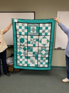 "Happiness is Quilting" a 2017 BOM quilt made by Irene B. from the El Campo Casual Quilt Guild. It's an original quilt design by TK Harrison from BOMquilts.com!