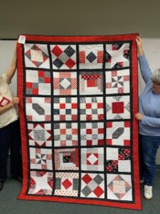 "Happiness is Quilting" a 2017 BOM quilt made by J Miranda from the El Campo Casual Quilt Guild. It's an original quilt design by TK Harrison from BOMquilts.com!