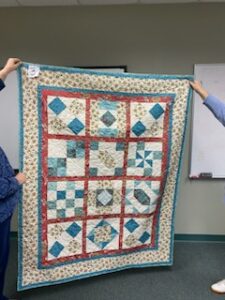 "Happiness is Quilting" a 2017 BOM quilt made by Mary Kay B. from the El Campo Casual Quilt Guild. It's an original quilt design by TK Harrison from BOMquilts.com!