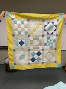 "Happiness is Quilting" a 2017 BOM quilt made by Renee B. from the El Campo Casual Quilt Guild. It's an original quilt design by TK Harrison from BOMquilts.com!