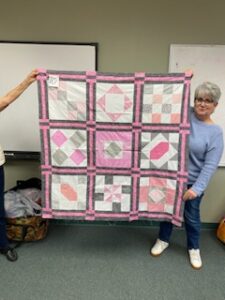 "Happiness is Quilting" a 2017 BOM quilt made by Sandra K. from the El Campo Casual Quilt Guild. It's an original quilt design by TK Harrison from BOMquilts.com!