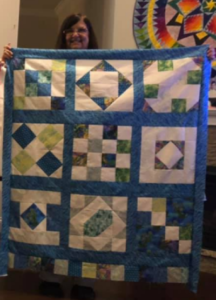 "Happiness is Quilting" 2017 BOM quilt is an original design by TK Harrison. Made by a member of the Piecemakers Quilt Guild!