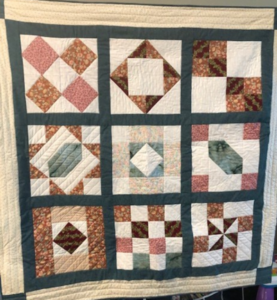 "Happiness is Quilting" 2017 BOM quilt is an original design by TK Harrison. Made by a member of the Piecemakers Quilt Guild!