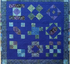 "Happiness is Quilting" 2017 BOM quilt is an original design by TK Harrison. Made by a member of the Piecemakers Quilt Guild!