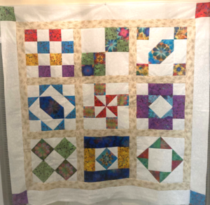 "Happiness is Quilting" 2017 BOM quilt is an original design by TK Harrison. Made by a member of the Piecemakers Quilt Guild!