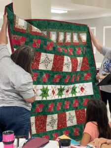 Wanda R. sewed my "Windowsill Wonders" 2018 Row of the Month quilt together! She's with the Holmes Valley Quilters from Holmes County, Florida!