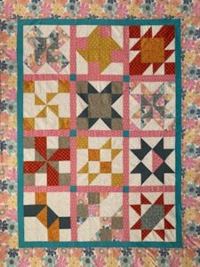 Bonnie C. sewed my original design "Cinnamon-teen Chocolate Figs & Roses" BOM quilt together!
