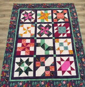 Janie D. sewed my original design "Cinnamon-teen Chocolate Figs & Roses" BOM quilt together!
