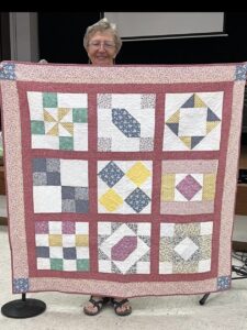 Barbara C. Sewed my 2017"Happiness is Quilting" BOM quilt together! She's part of the "Disconnected Piecers Quilt Guild! Free pattern is from BOMquilts.com & is designed by TK Harrison!
