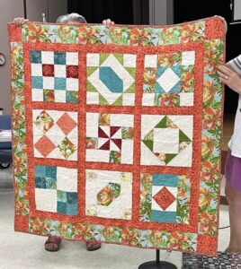 Shirley R. Sewed my 2017"Happiness is Quilting" BOM quilt together! She's part of the "Disconnected Piecers Quilt Guild! Free pattern is from BOMquilts.com & is designed by TK Harrison!