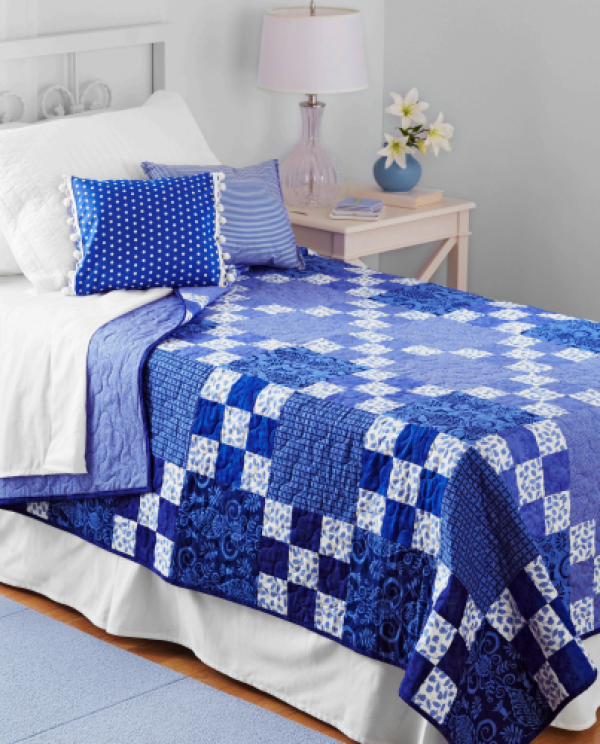 “Rhapsody in Blue” is a Free Nine-Patch Quilt Pattern designed by Marinda Stewart from American Patchwork & Quilting!