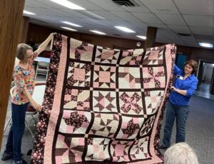 "Cinnamon-teen Chocolate Figs & Roses" BOM quilt sewn together by Sandy of the Central Kansas ThreadBenders Quilt Guild! This quilt was designed exclusively for BOMquilts.com!