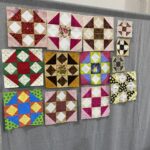 One set of "Quilted Kitchen Sampler" BOM quilt blocks made by a member of the Huntington Quilt Guild! The "Quilted Kitchen Sampler" BOM quilt was designed by TK Harrison, owner of BOMquilts.com!