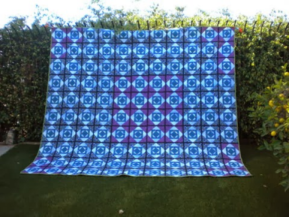 “Glowing Pineapple” Free QAYG Quilt Pattern designed by Sylvia Q. Davis but made by Janet from California Quilting