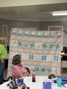 Gerry S. sewed my "Windowsill Wonders" 2018 Row of the Month quilt together! She's with the Holmes Valley Quilters from Holmes County, Florida!