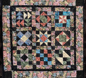 "Happiness is Quilting" 2017 BOM quilt is an original design by TK Harrison. Made by a member of the Piecemakers Quilt Guild!