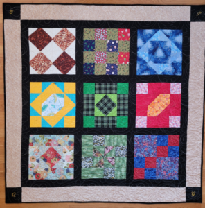 "Happiness is Quilting" 2017 BOM quilt is an original design by TK Harrison. Made by a member of the Piecemakers Quilt Guild!