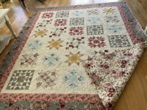 Kathy S. sewed my 2022 "Majestic Beauty" BOM quilt together! It's an Original Design by TK Harrison for BOMquilts.com!