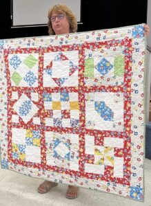 Karla S. Sewed my 2017"Happiness is Quilting" BOM quilt together! She's part of the "Disconnected Piecers Quilt Guild! Free pattern is from BOMquilts.com & is designed by TK Harrison!