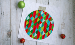 "Christmas Ornament" is a Free Modern Mini Christmas Quilt Pattern Designed by Lee. A. Heinrich from Freshly Pieced!