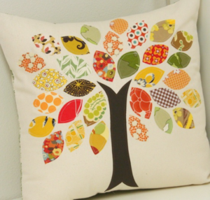 "Scrap Buster Fall Pillow" is a Free Autumn Quilted Pillow Pattern designed by Allison from Cluck Cluck Sew!