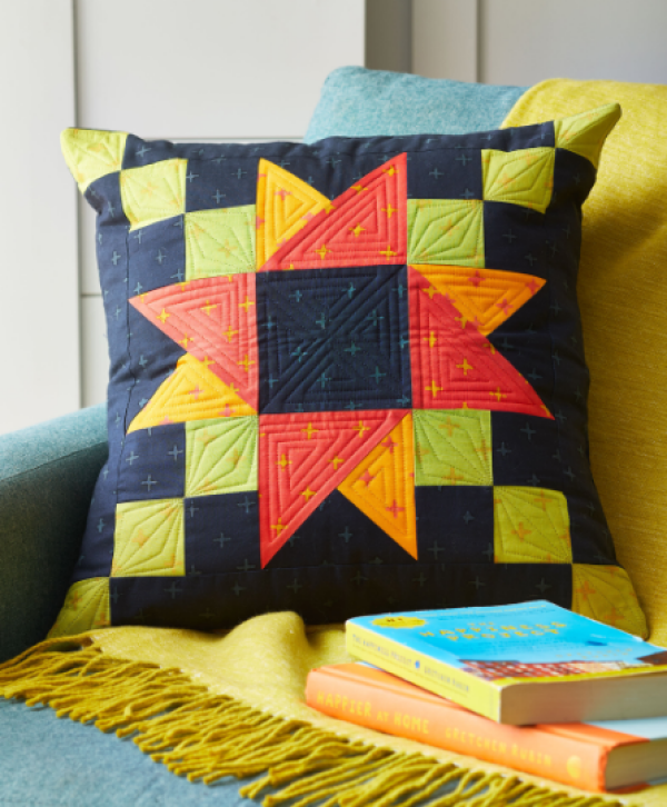 "Starburst Pillow" is a Free Autumn Quilted Pillow Pattern designed by Kelli Marshall of Simply Mackbeth Co. from All People Quilt!