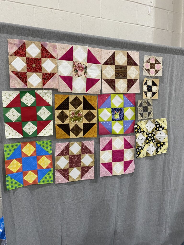 One set of "Quilted Kitchen Sampler" BOM quilt blocks made by a member of the Huntington Quilt Guild! The "Quilted Kitchen Sampler" BOM quilt was designed by TK Harrison, owner of BOMquilts.com!