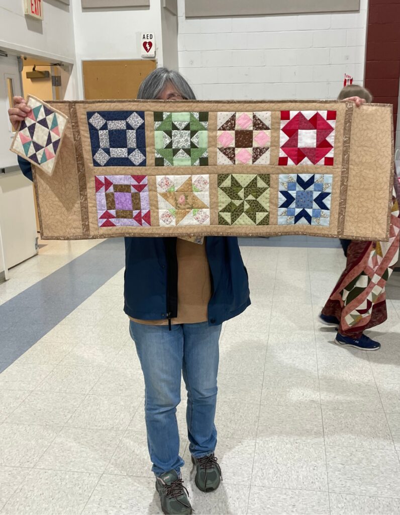 One set of "Quilted Kitchen Sampler" BOM quilt blocks made by a member of the Huntington Quilt Guild! The "Quilted Kitchen Sampler" BOM quilt was designed by TK Harrison, owner of BOMquilts.com!